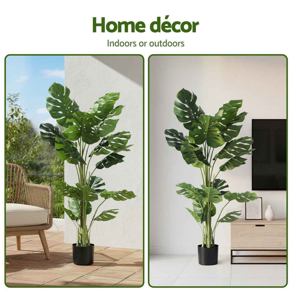 Artificial monstera tree with lush green leaves in a black pot