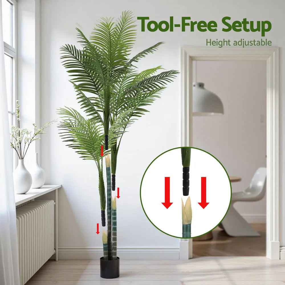 Artificial palm tree with green fronds in black pot
