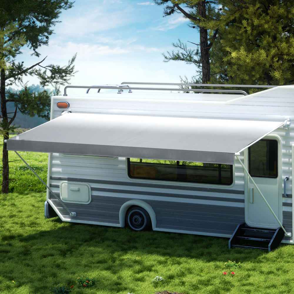 RV replacement awning fabric in light gray extended over camper front