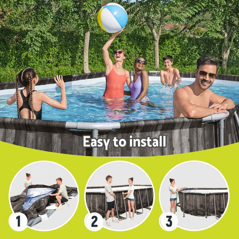 Above-ground swimming pool with dark gray steel frame and blue water in backyard
