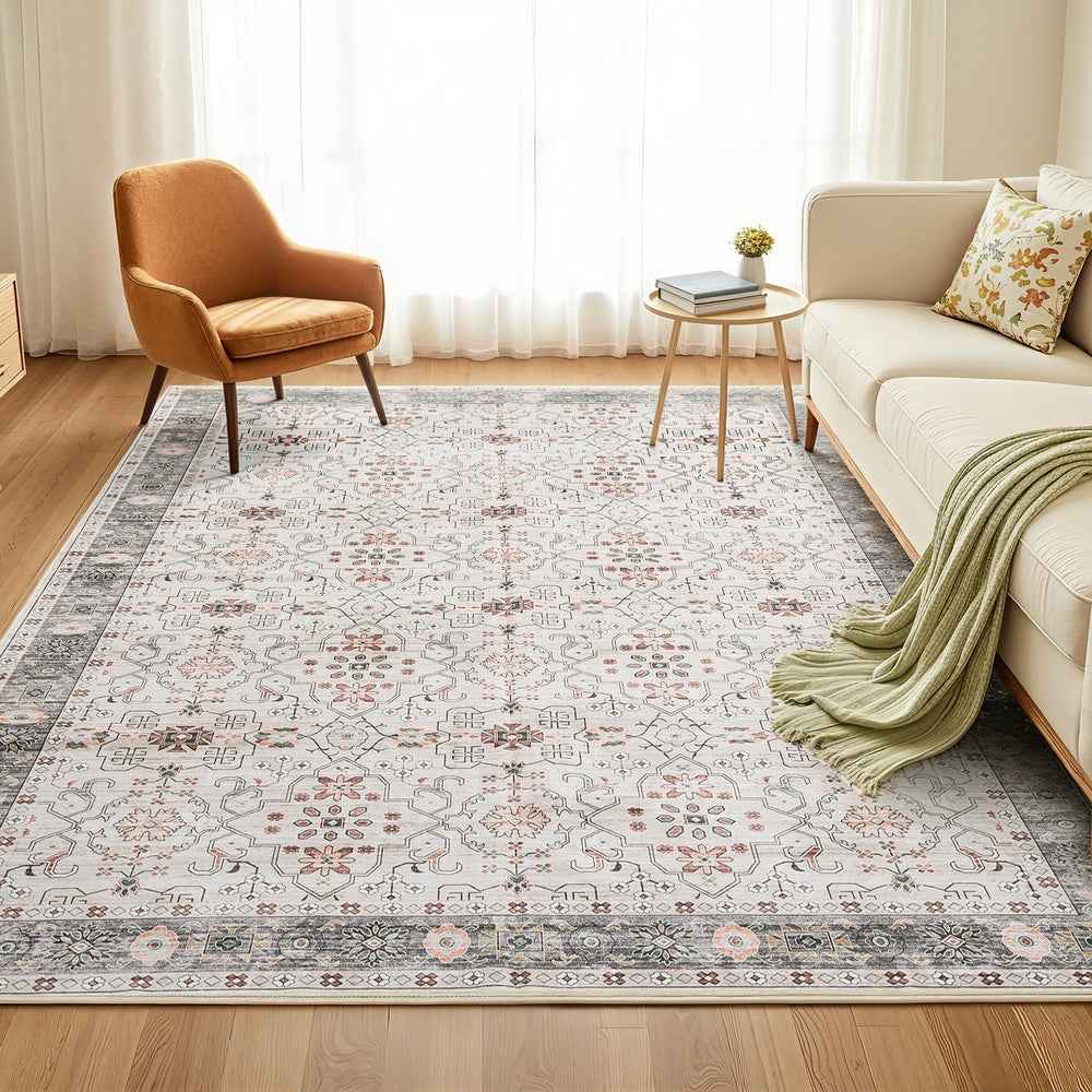 Large patterned area rug in light gray with multicolor medallion design in a living room
