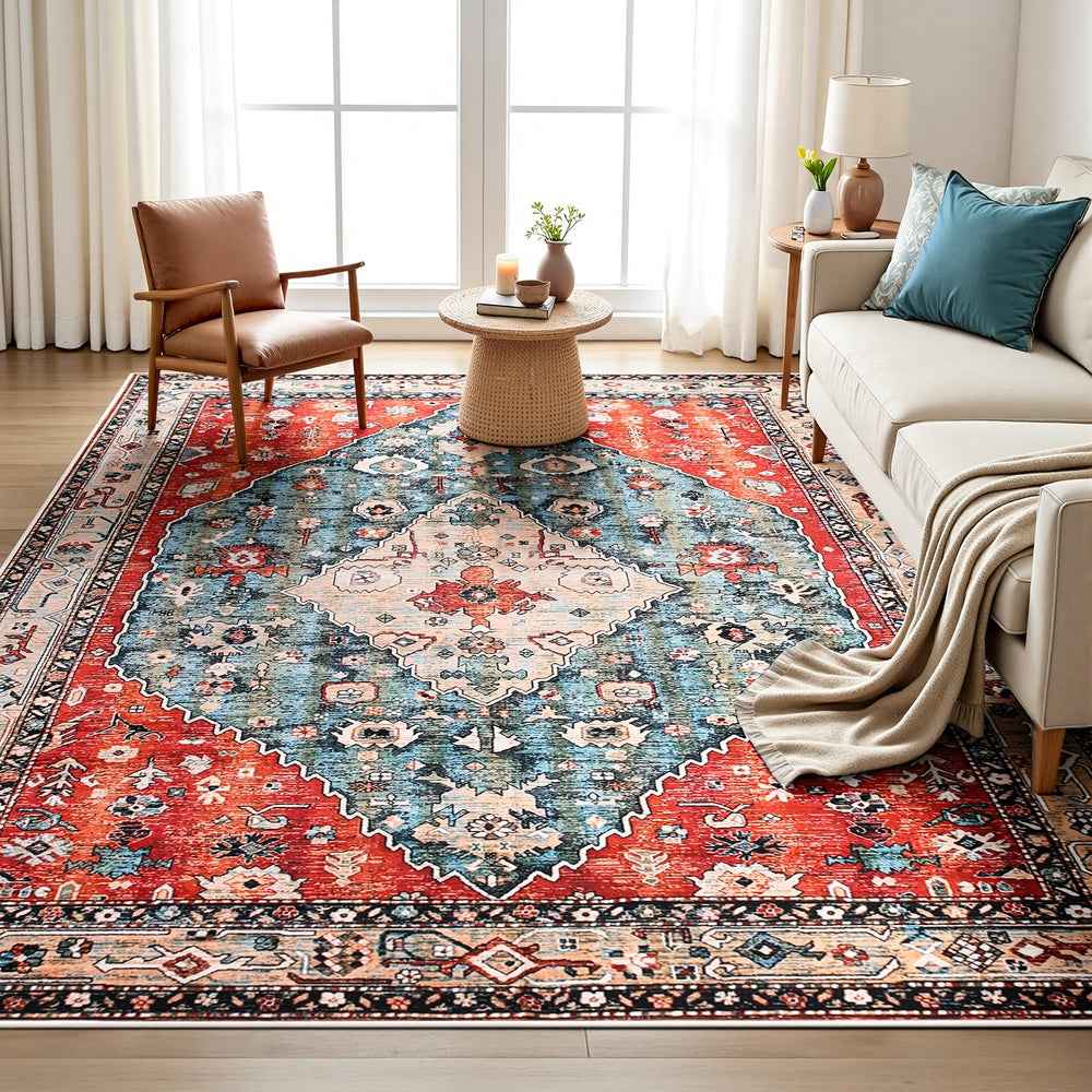 Large rectangular area rug with red outer border and centered blue medallion pattern