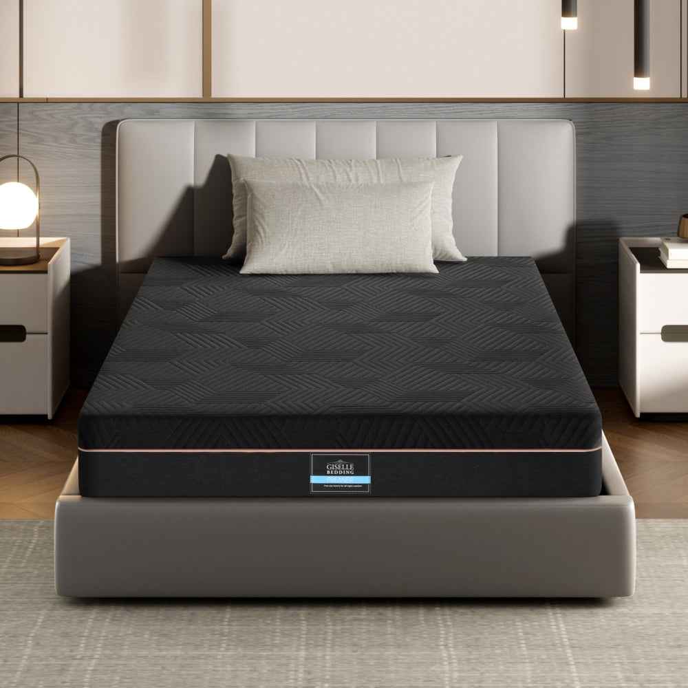 Single memory foam mattress on base with dark cover and centered brand label strip