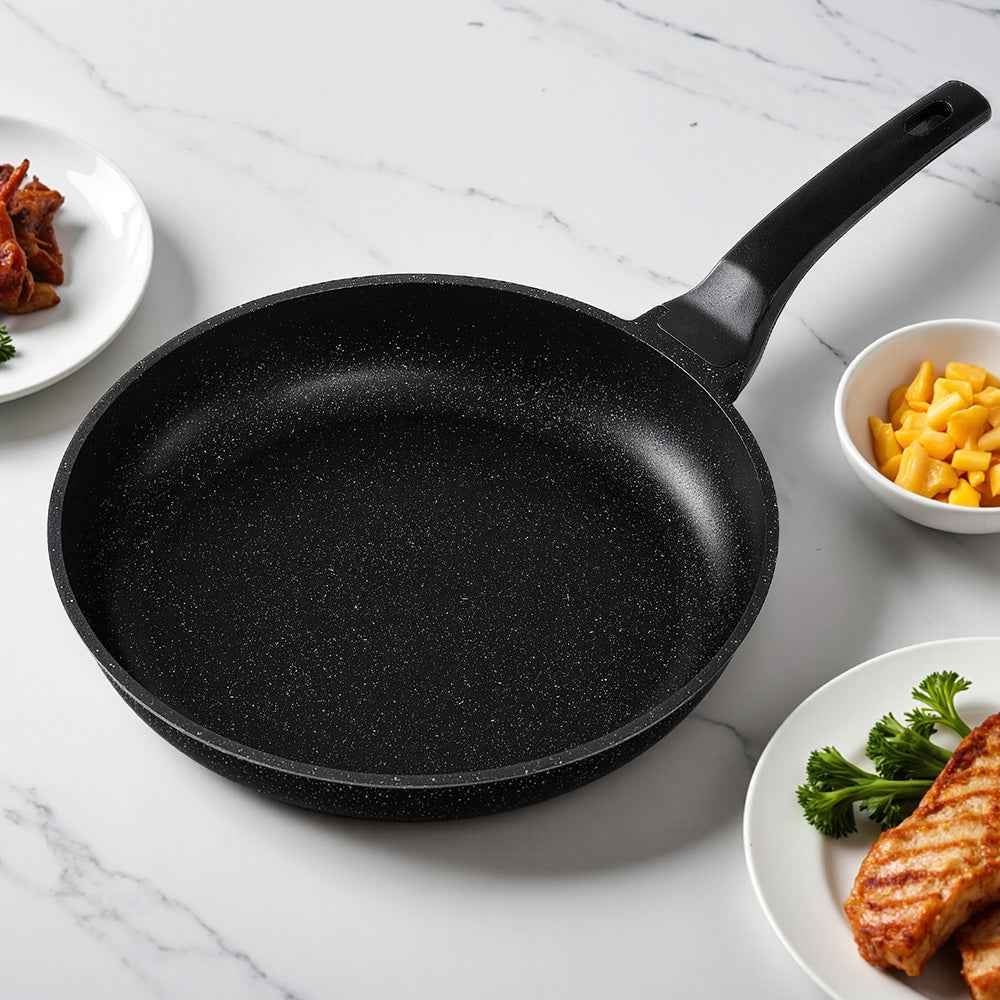 Nonstick frying skillet, black speckled surface, long handle, shallow sides