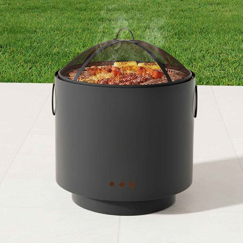 Portable deep bowl fire pit with mesh spark screen, side handles, burning logs