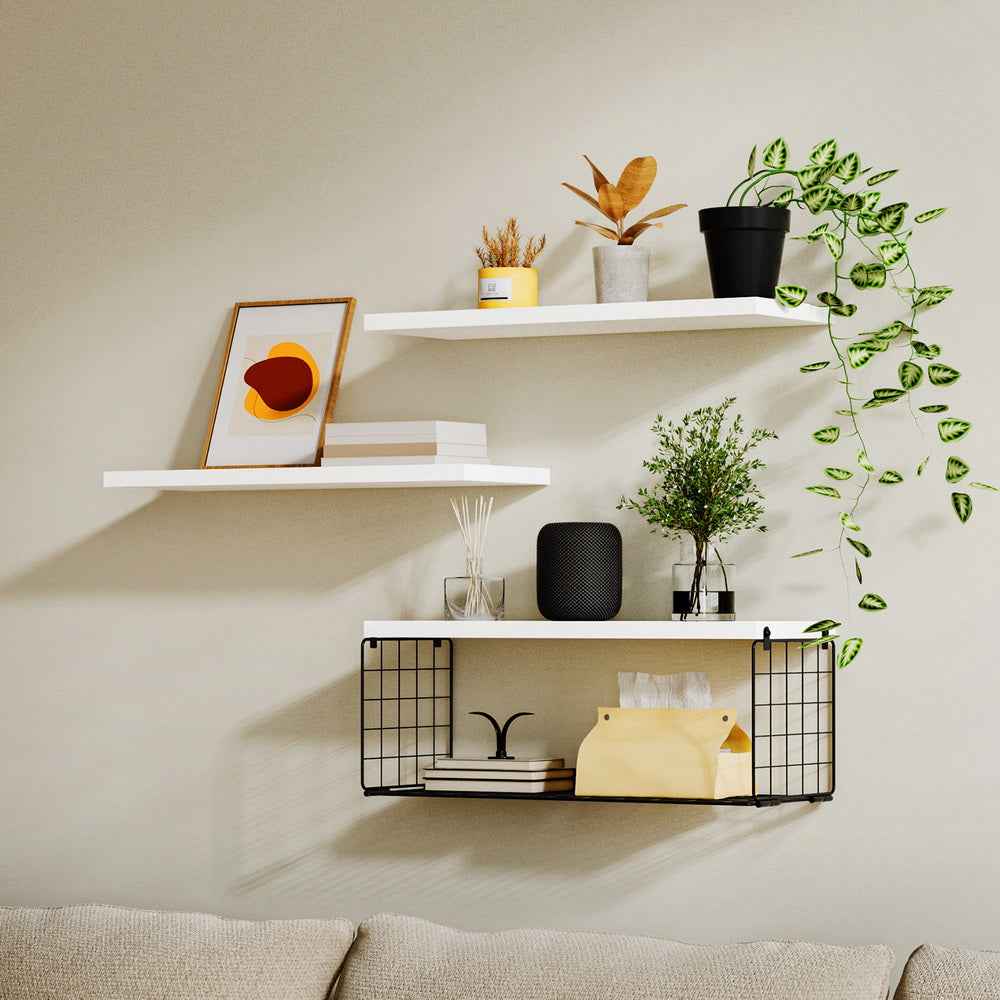 White floating wall shelves with black wire basket and small decor items