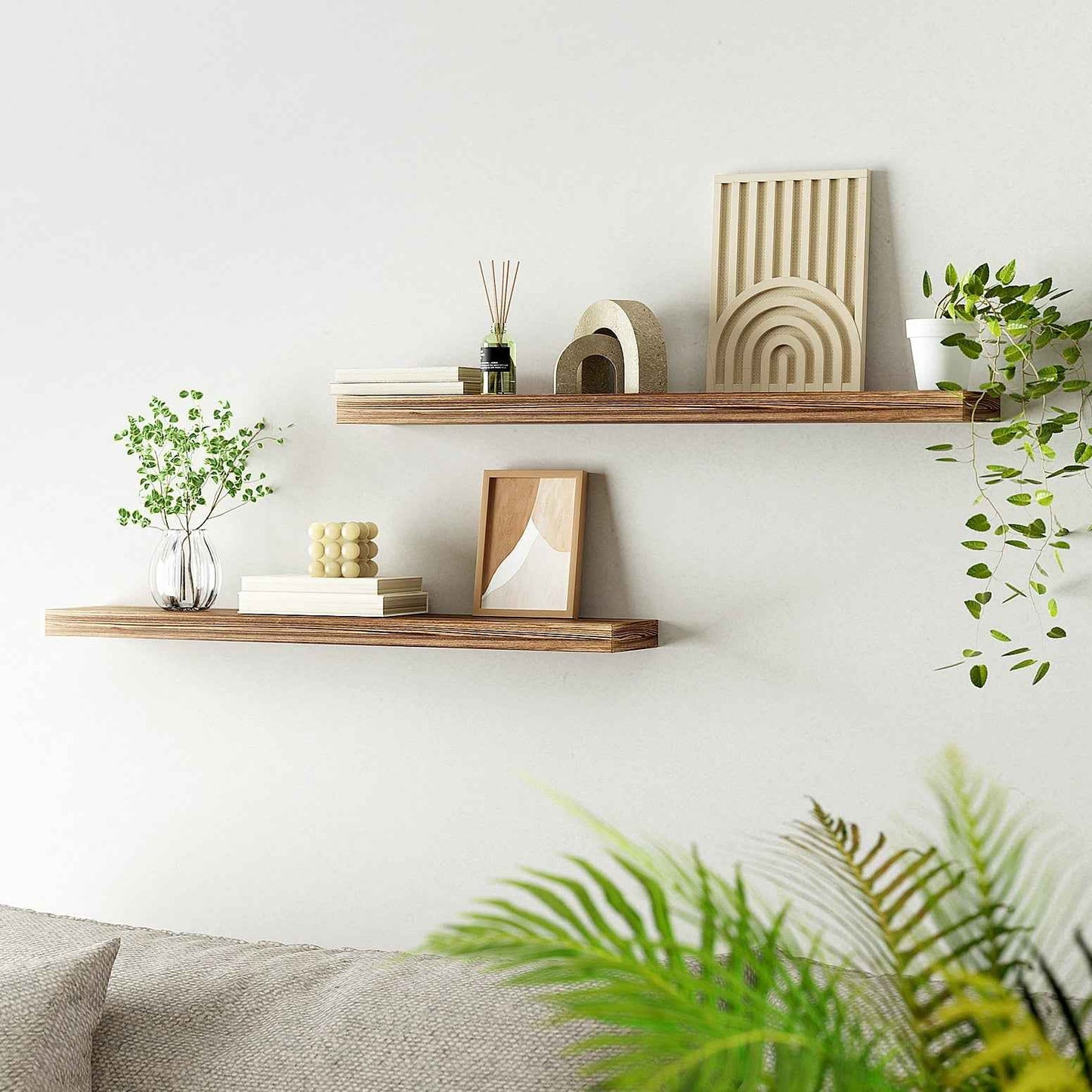 Natural wood floating wall shelves set of 2 with potted plants and books
