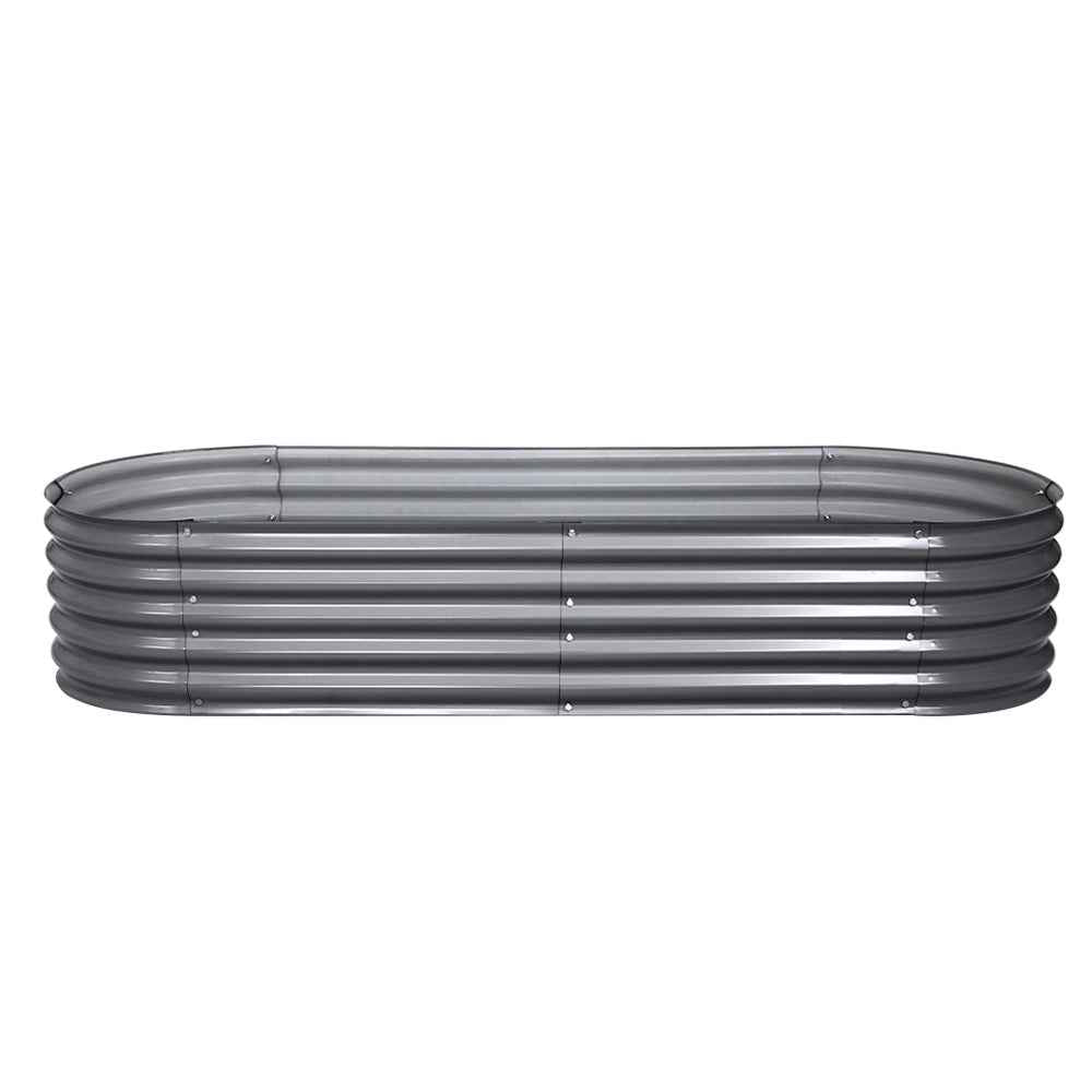 Oval raised galvanised garden bed with ribbed dark grey sides, open top view