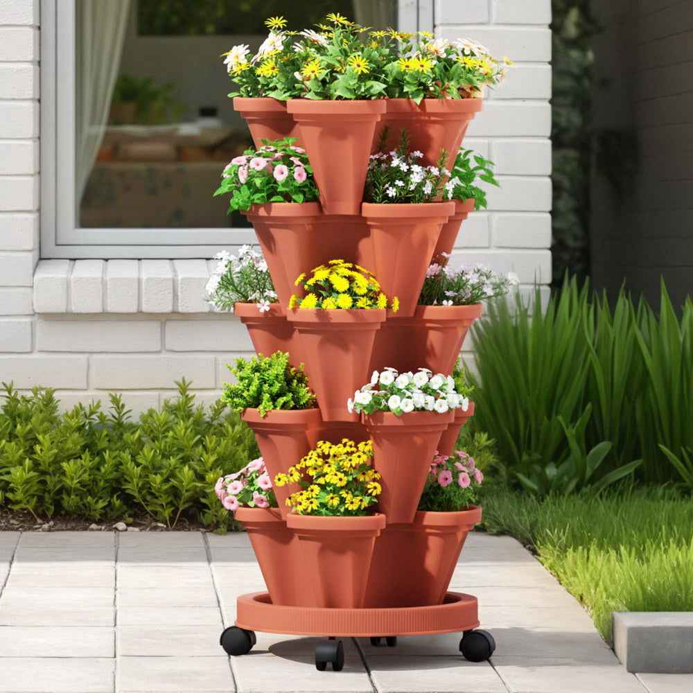 Brick red 5-tier vertical planter tower on casters with flowering plants outdoors