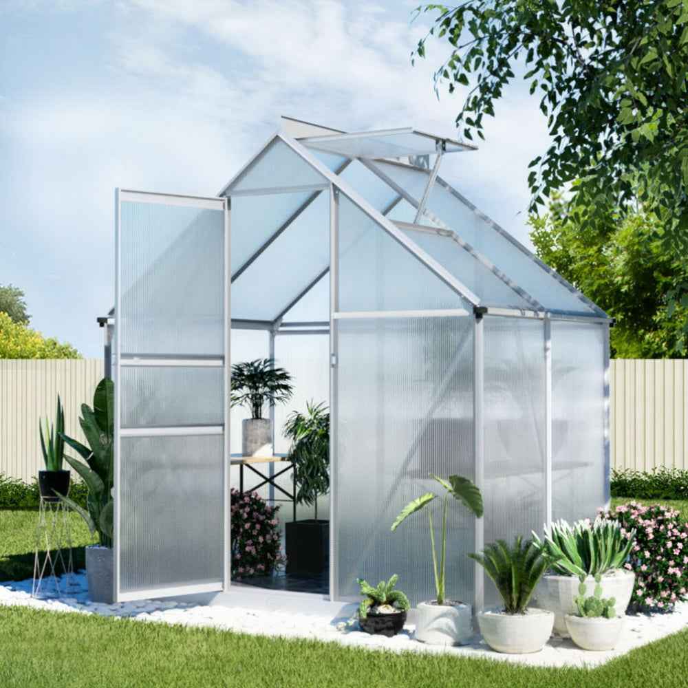 Polycarbonate garden storage shed with clear walls and sloped roof