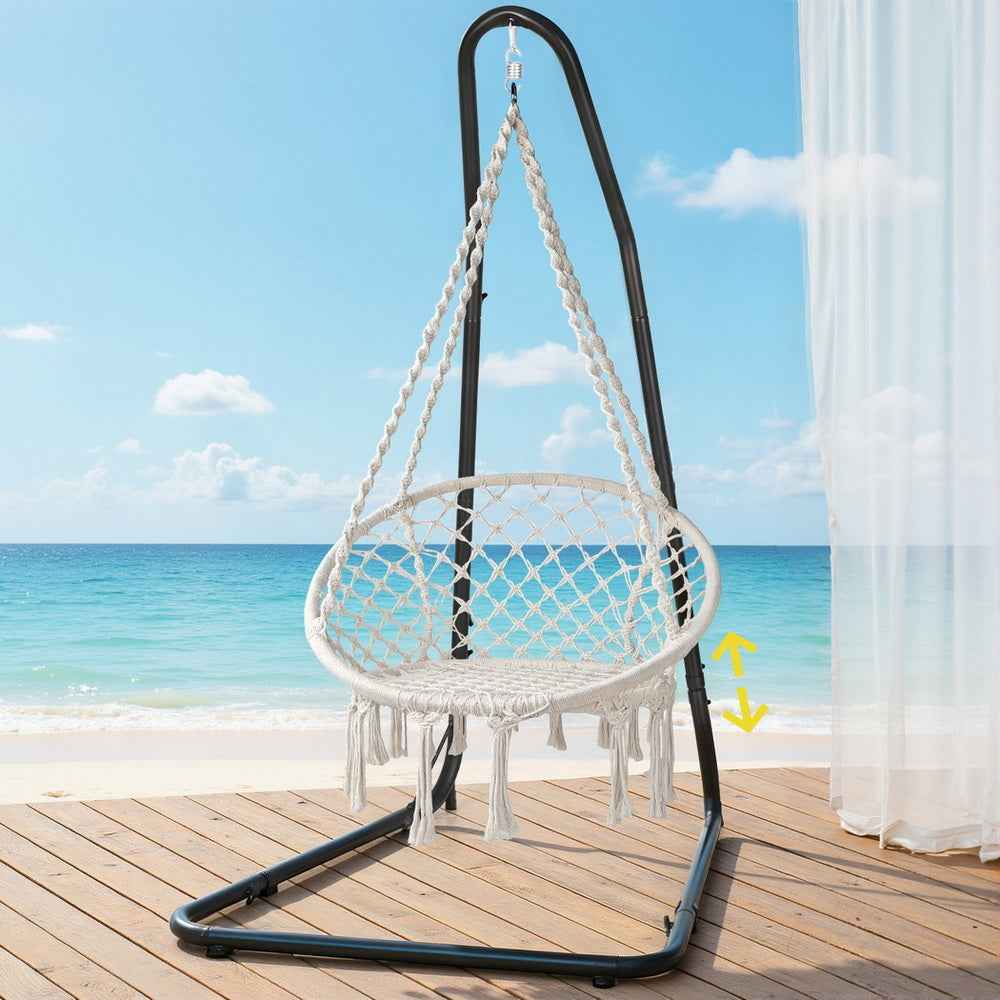 Black steel hanging hammock chair with white fringed mesh seat