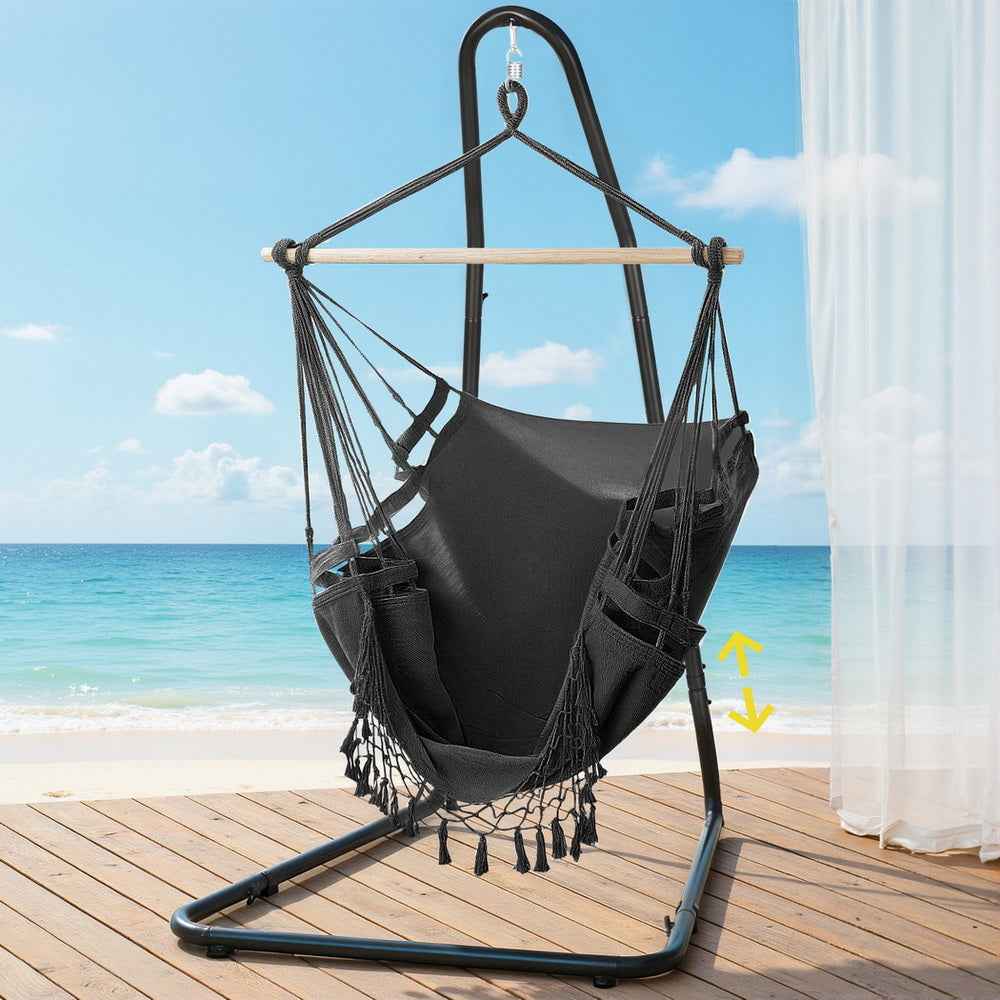 Black hanging hammock chair with steel stand, suspended fabric seat with woven sides