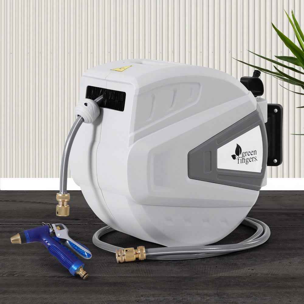 Wall-mounted retractable hose reel in white with blue spray gun and gray hose