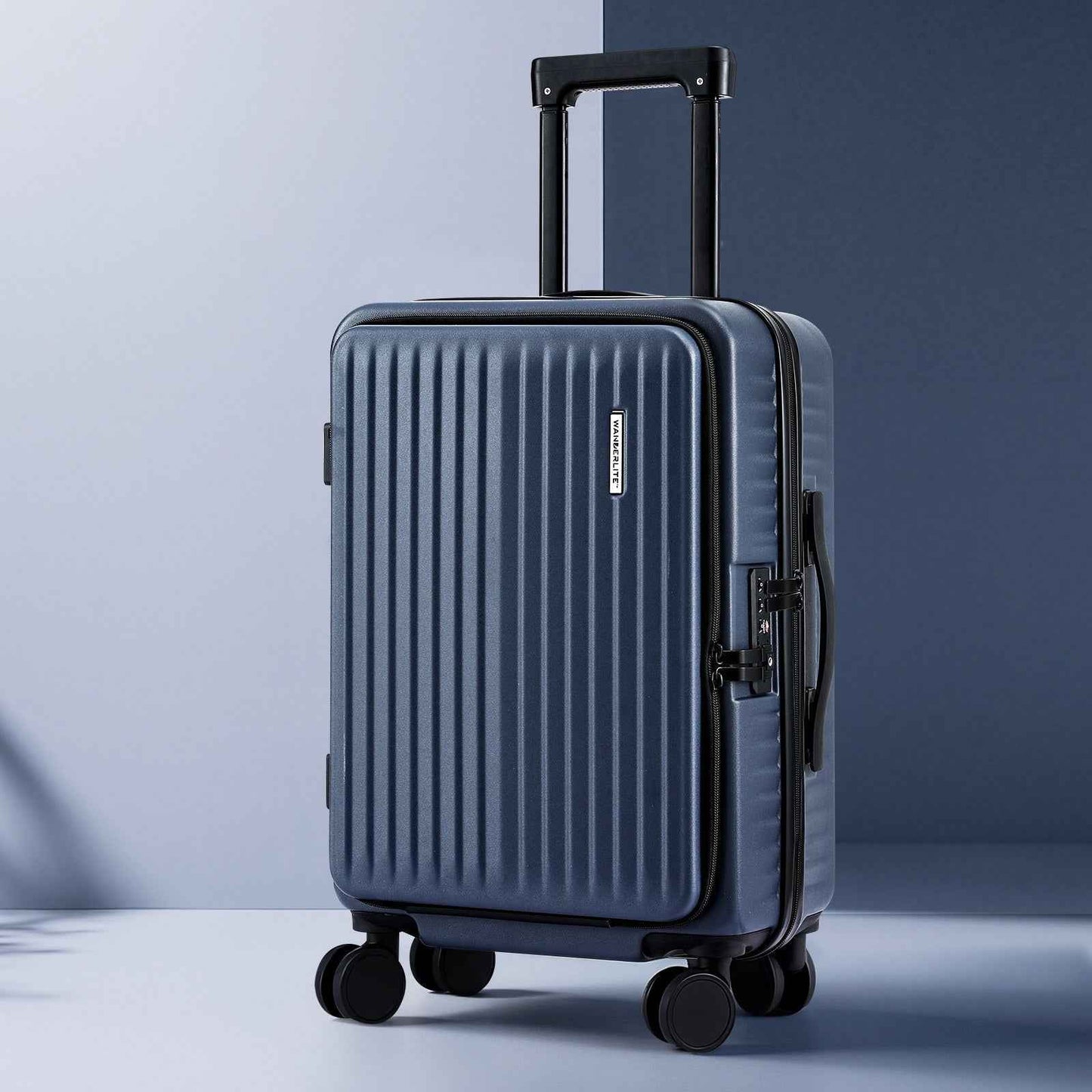 Navy hardshell carry-on suitcase with ridged shell, side pocket, and four wheels