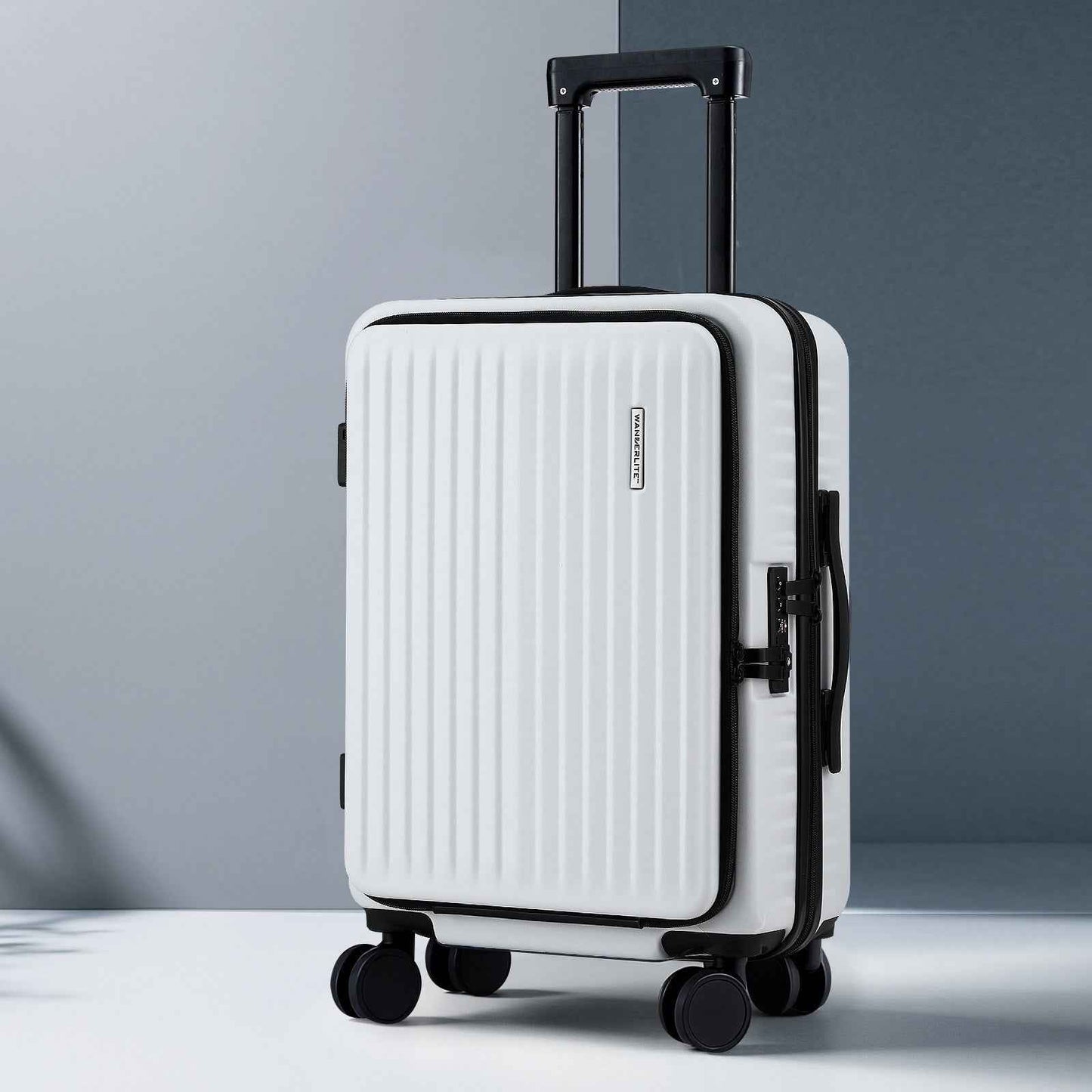 White hard-shell carry-on suitcase front three-quarter view, telescoping handle and spinner wheels.