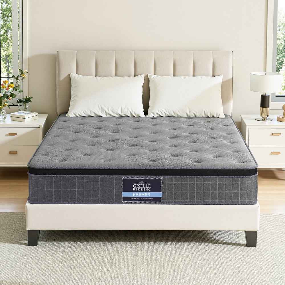 Double latex foam mattress on bed, dark gray quilted top with stitched edge border