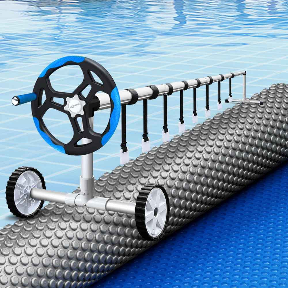 Solar pool cover roller with bubble-textured blanket roll and hanging straps