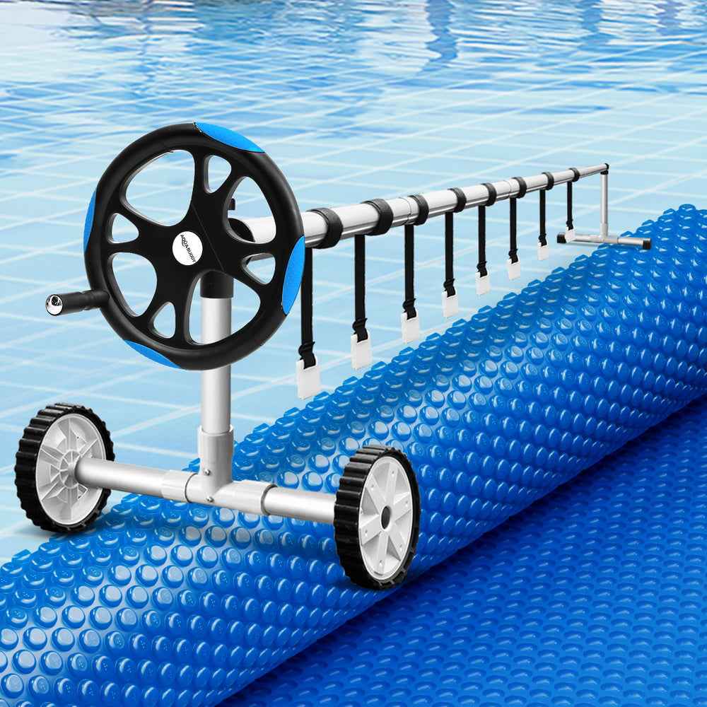 Blue solar pool cover roller with black wheels and textured blanket