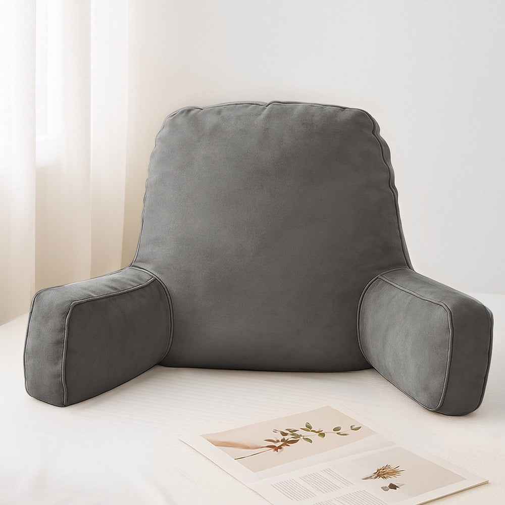 Grey reading pillow back rest with padded arm bolsters on bed