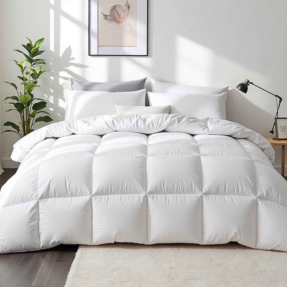 White box-stitched duck down quilt on a bed, full bedding cover