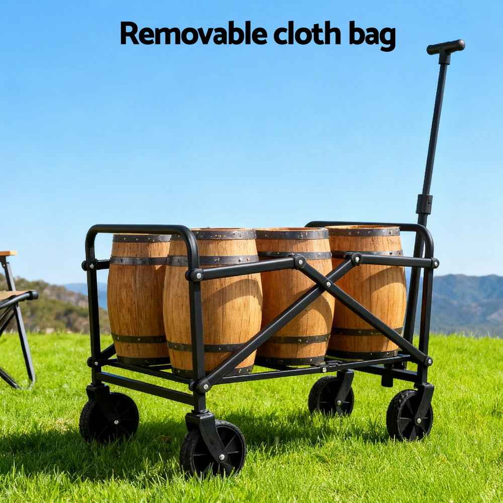 Black folding cart with fabric bed carrying wood barrels and four swivel wheels