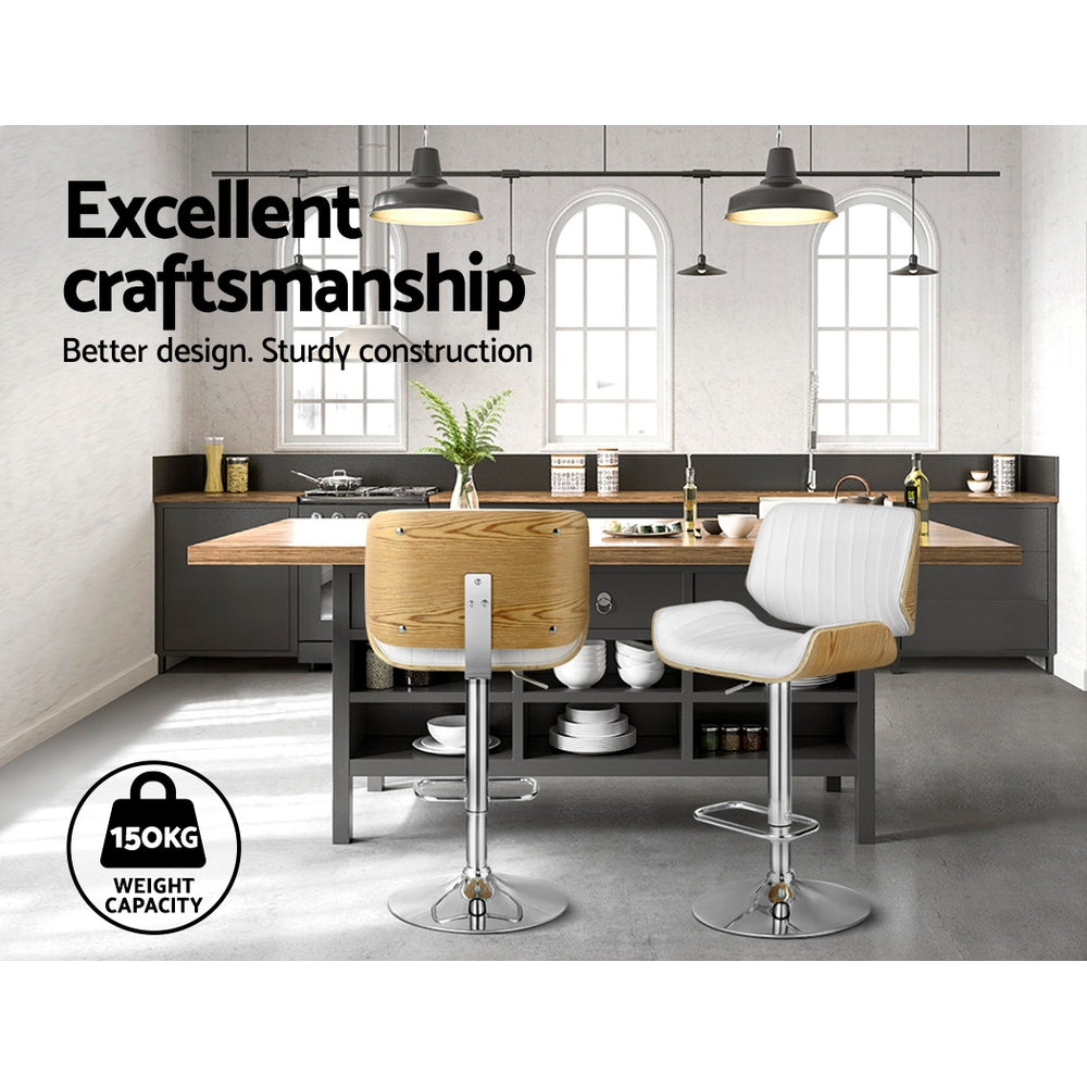 Adjustable bar stool set with white padded seats, light wood panels, chrome pedestal bases
