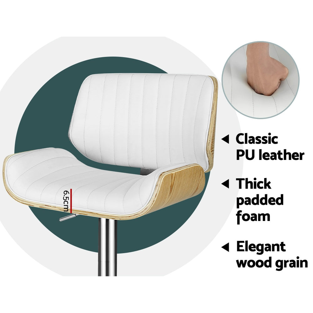 White bar stool with PU leather look, thick padding, light wood grain trim, chrome stem