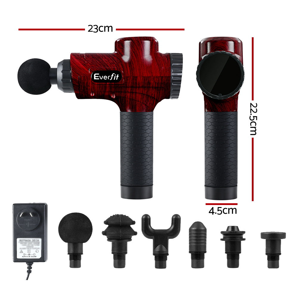 Red handheld massage gun with black grip and included attachment head set