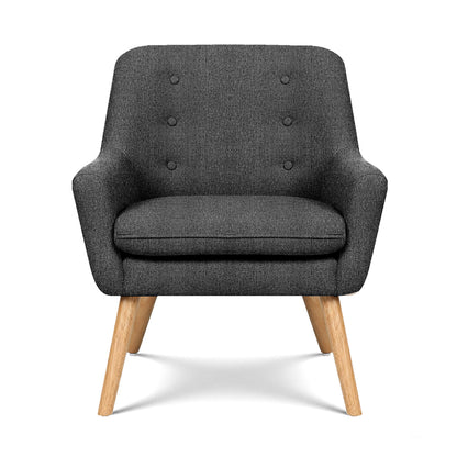 Charcoal upholstered armchair with button-tufted back, rounded arms, and wooden legs