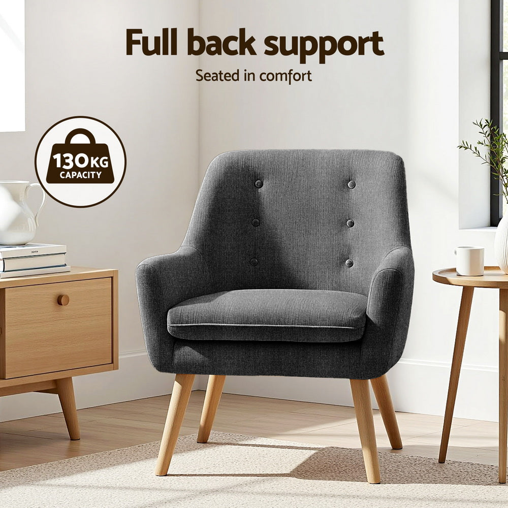 Charcoal upholstered armchair with button-tufted back, cushioned seat, wooden legs