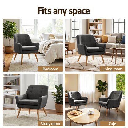 Charcoal upholstered armchair with tufted back and wooden legs