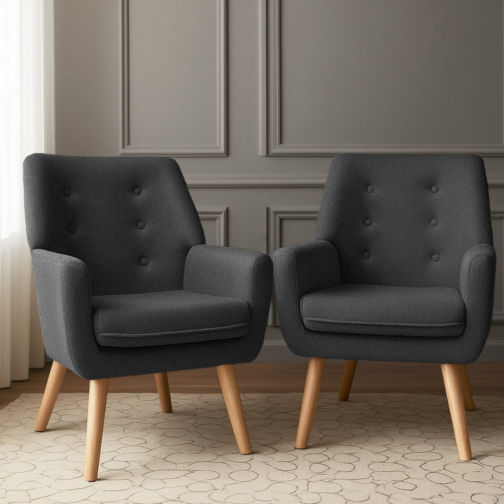 Charcoal fabric lounge chairs with tufted backs, rolled arms, and wooden legs